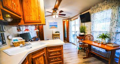 Lakeside Place 1 (Sleeps 1-6) - Tiny living space with a queen bed, and 3 twin beds perfect for kids