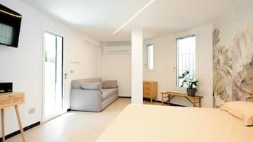 Quarto triplo família, varanda | Escrivaninha, espaço de trabalho para notebook, Wi-Fi de cortesia