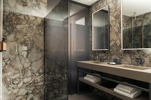 Deluxe Room | Bathroom | Hair dryer, slippers, towels, soap