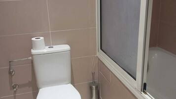 Shower, towels, soap, toilet paper