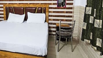 Deluxe Quadruple Room, City View | In-room safe, desk, soundproofing, free WiFi