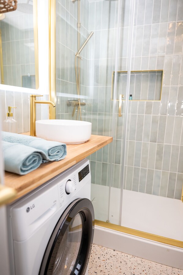 Shower, hair dryer, towels, soap