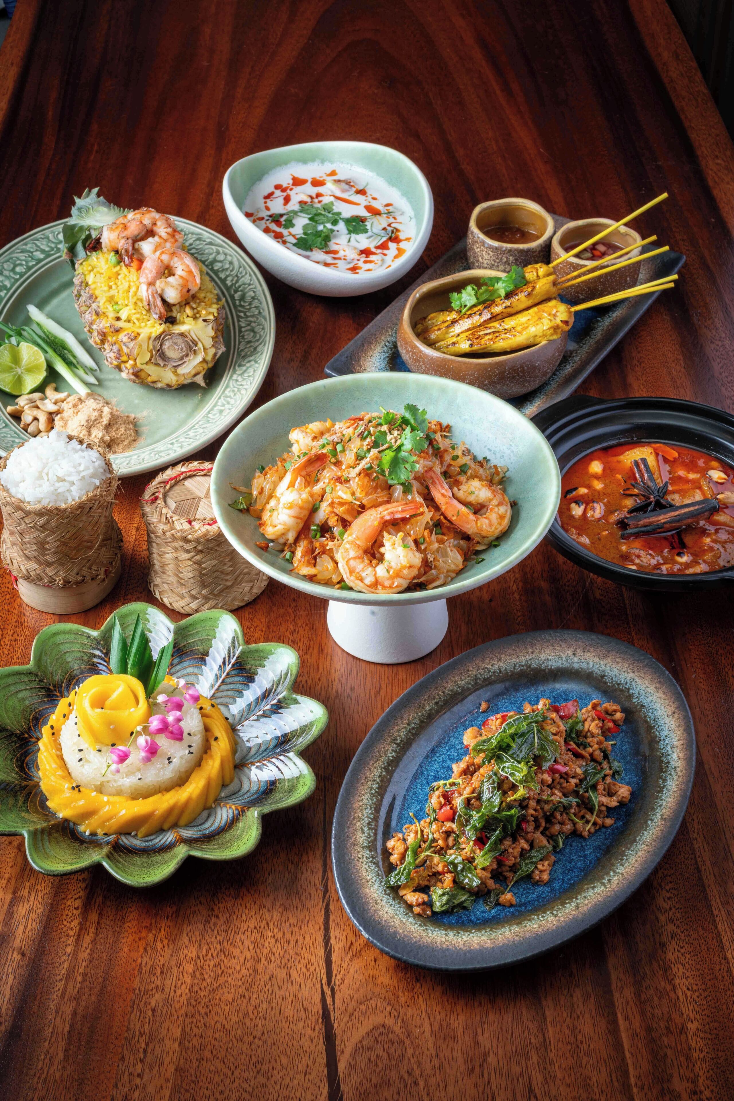 A variety of dishes on a wooden table.
