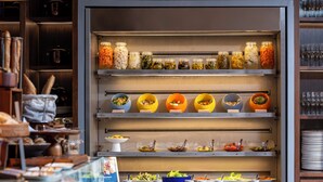 A buffet with various food items and condiments. - TRIBE Phuket Patong by Accor (Patong)
