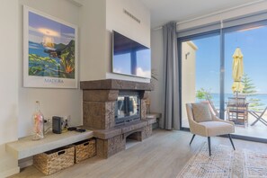 Exclusive Apartment, Ocean View | Living area | 45-inch flat-screen TV with cable channels