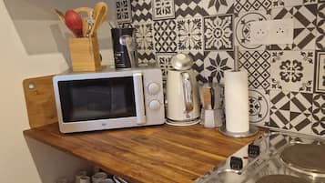 Microwave, stovetop, coffee/tea maker, electric kettle