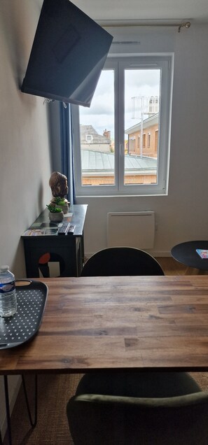 Comfort Apartment, City View | Living area | 80-cm flat-screen TV with digital channels