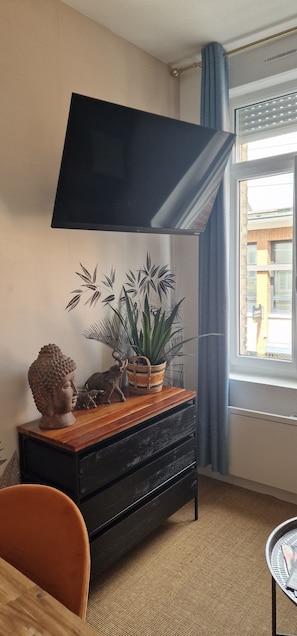 Comfort Apartment, City View | Living area | 80-cm flat-screen TV with digital channels