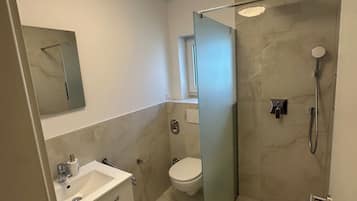 Hair dryer, towels, soap, toilet paper