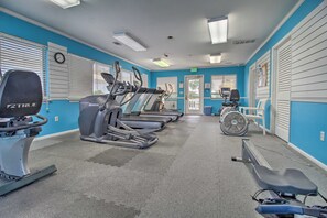 A gym with treadmills, a stationary bike, and a rowing machine. - Oceanfront Condo in Harbor Island Community! (Harbor Island)