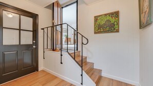 A staircase with wooden steps and black metal railings, leading to an upper floor. - Home 3 Mi to Main St Julian: Great for Groups! (Julian)
