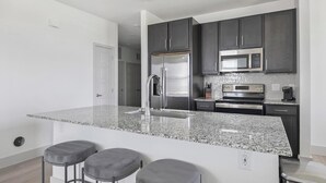 Fridge, dining table - Landing | Incredible 2BD, Pool, Gym (Manor)