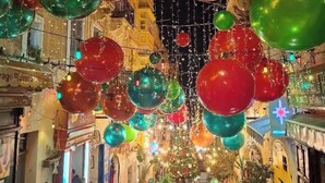 A restaurant with festive decorations, including hanging ornaments and a 'Christmas' sign. - Valletta Penthouse Cathedral view Terrace (Valletta)