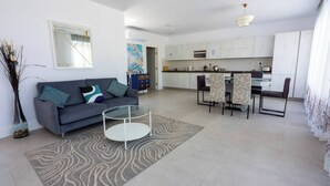 A modern apartment with a living room, dining area, and kitchen. - Valletta Penthouse Cathedral view Terrace (Valletta)