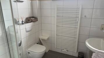 Shower, towels, soap, toilet paper