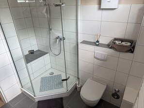 Shower, towels, soap, toilet paper