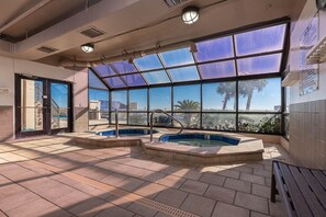 Relax by the pool with a breathtaking view of the surrounding landscape through large windows.