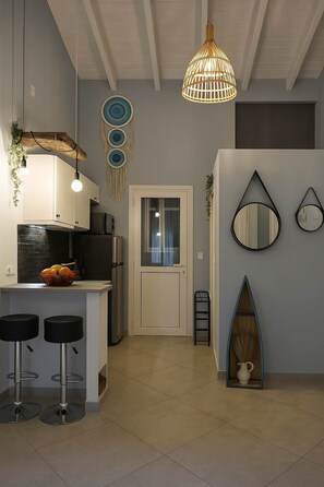 Fridge, microwave, stovetop, coffee/tea maker