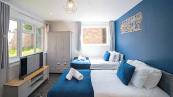 Appartement, uitzicht op tuin | 1 slaapkamer, een strijkplank/strijkijzer, gratis wifi, beddengoed