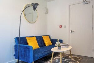 Apartment, Garden View | Living area | 40-inch Smart TV with digital channels