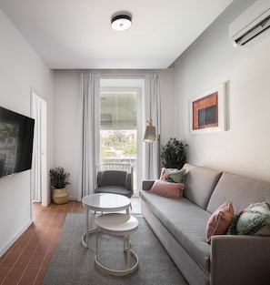 Apartment, 2 Bedrooms | Living area | 50-cm Smart TV with cable channels