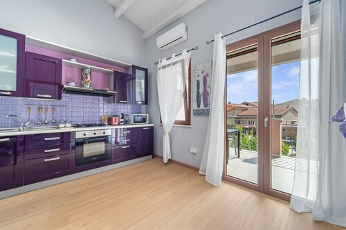 Apartment 'Di Pina' with Private Terrace, Shared Garden and Air Conditioning