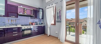 Appartement 'Di Pina' avec terrasse privée, jardin partagé et climatisation