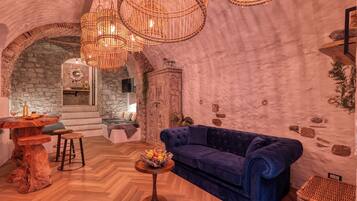 Honeymoon Apartment, Multiple Bedrooms (Boutique Apartment Bucanieri Luxury) | Living area | 21-inch Smart TV with cable channels