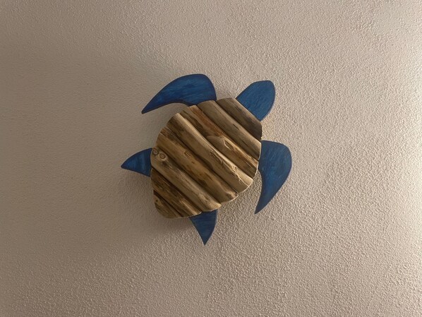 A turtle-shaped object with a textured surface and blue accents.
