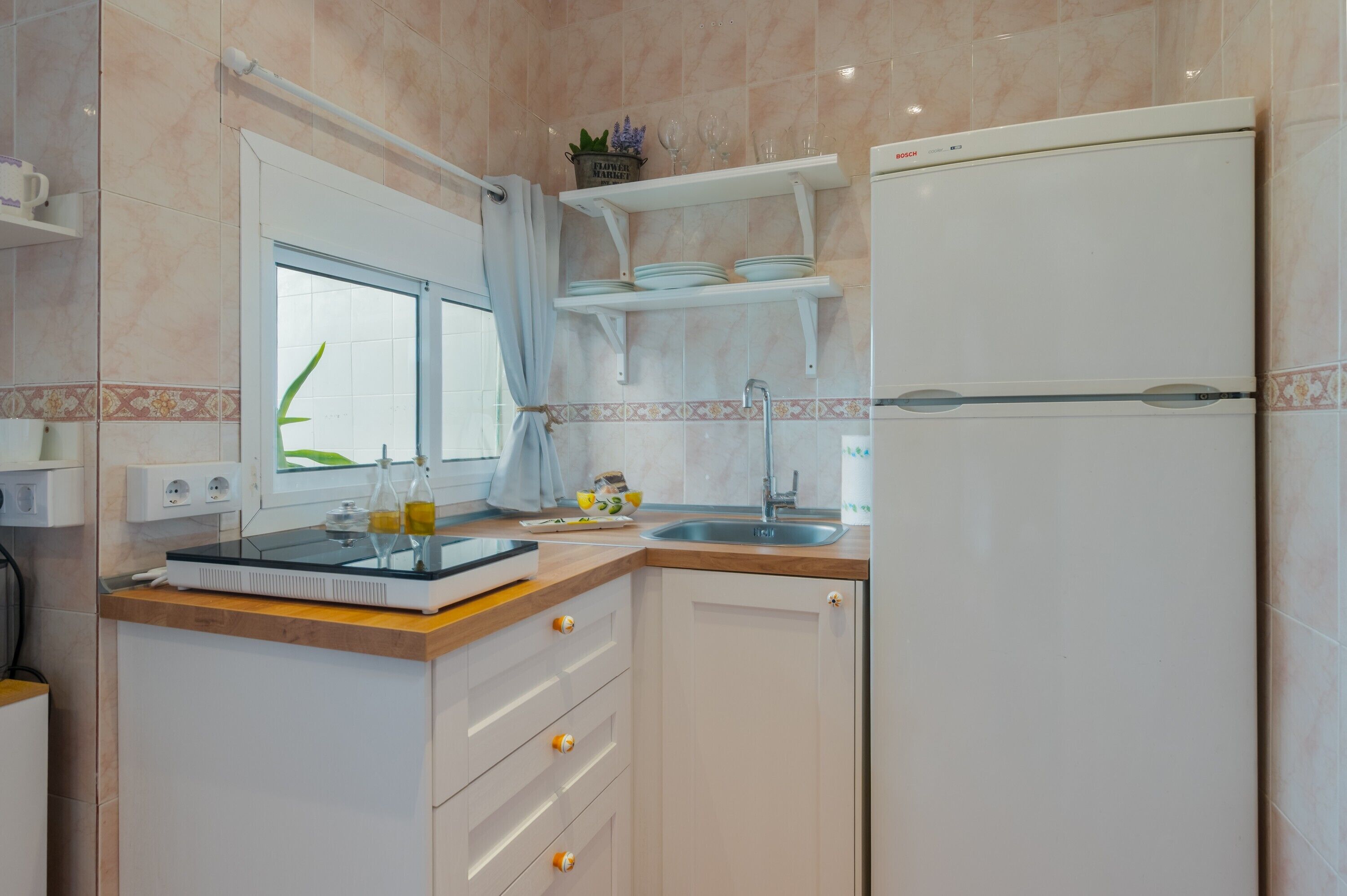 Fridge, microwave, stovetop, coffee/tea maker