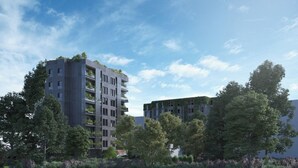 A modern multi-story building with balconies, surrounded by lush greenery and trees. - Kira Suites Hotel Milano (Milan)
