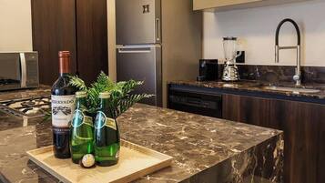 Fridge, microwave, blender, cookware/dishes/utensils