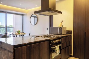 Fridge, microwave, stovetop, coffee/tea maker