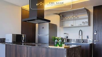 Fridge, microwave, stovetop, coffee/tea maker