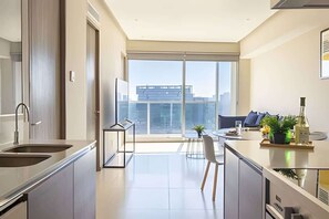 Fridge, microwave, coffee/tea maker, cookware/dishes/utensils