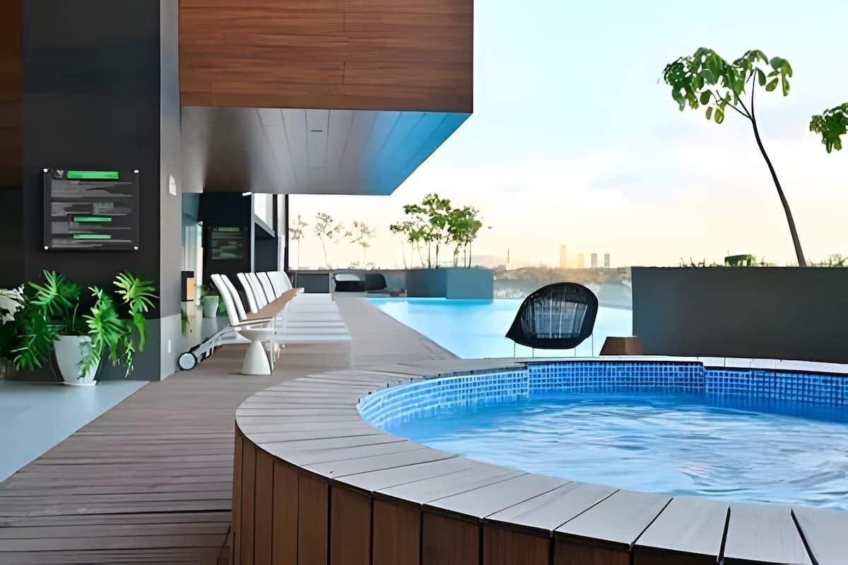 Relax in the shared outdoor hot tub on a stylish terrace, a peaceful spot to soak while enjoying open-air views