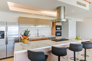 Fridge, microwave, coffee/tea maker, cookware/dishes/utensils