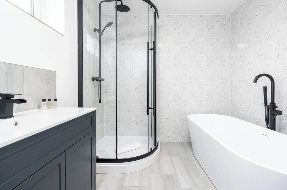 Shower, hair dryer, towels, shampoo