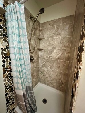 Shower, hair dryer, towels, soap