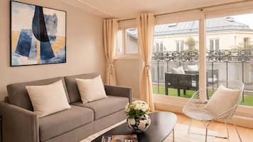 Departamento superior, vista a la ciudad | Área de sala de estar