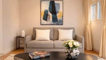 Apartamento superior, vista para a cidade | Área de estar