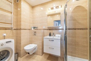 Shower, hair dryer, towels, soap