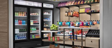 A snack display area with various packaged snacks and beverages.