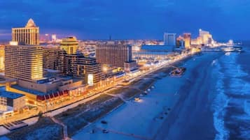 Stroll along the bustling promenade, offering ocean views and access to a wide, sandy beach.