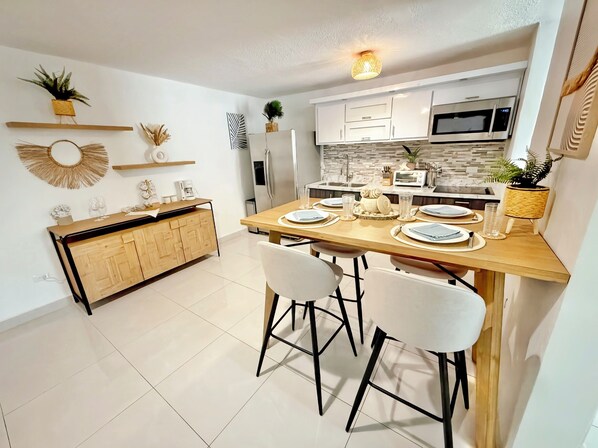 Fridge, microwave, stovetop, coffee/tea maker