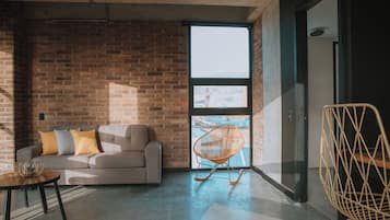 Design Apartment, City View | Living area | 43-inch Smart TV with digital channels, Netflix, streaming services