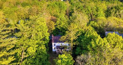 Relax in Style at Historic Modern on Main With Modern Amenities & Wooded Views