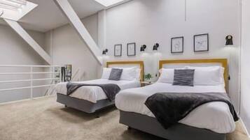 1 bedroom, desk, iron/ironing board, travel crib