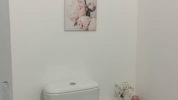 Shower, towels, soap, toilet paper