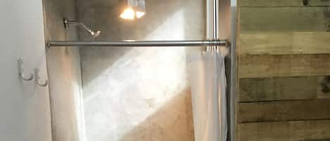 Shower, towels, soap, toilet paper